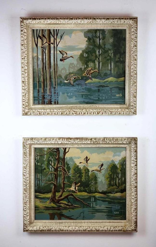 PAIR OF VINTAGE MID-CENTURY PAINT BY NUMBER 'FLYING DUCKS' PAINTINGS: *A pair of vintage mid-century 'paint by number' paintings, portraying flying ducks over water and presented in ornate, distressed frames. Dimensions: 20"h x 24"w Artist or Maker: Un