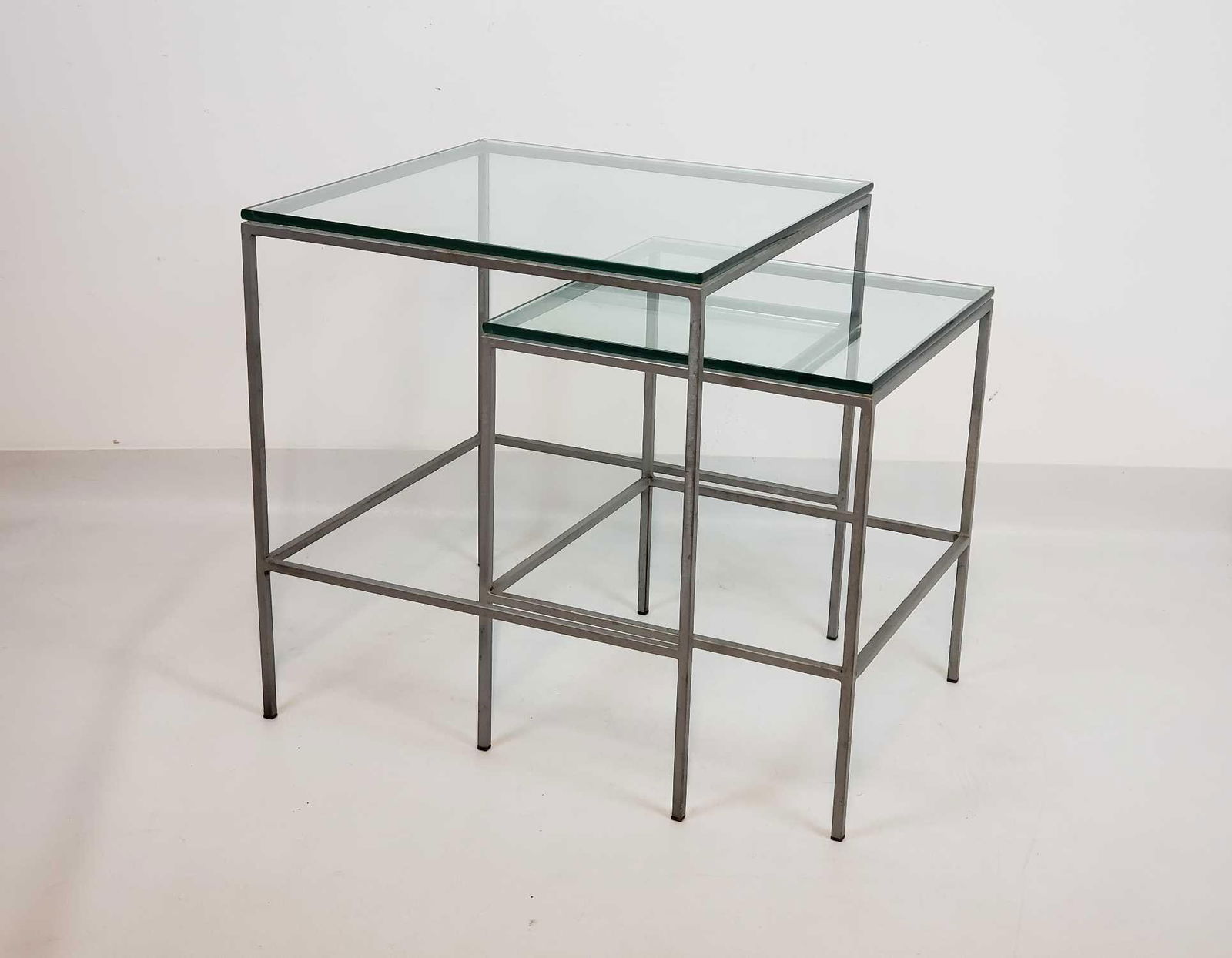 TWO GLASS TOP METAL NESTING TABLES (1 of 7)