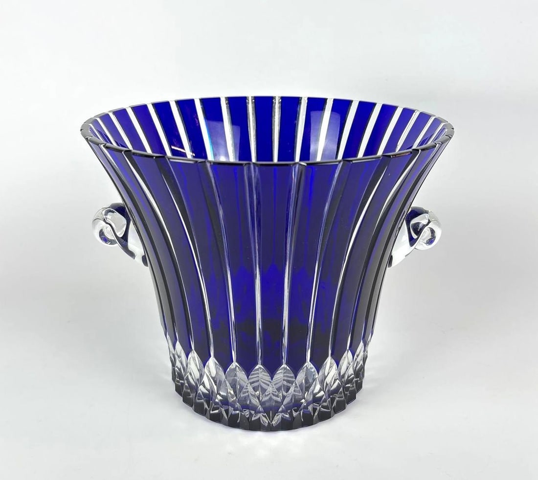 AJKA CASTILLE COBALT BLUE CRYSTAL ICE BUCKET: Murano style blue cut to clear Hungarian Crystal ice bucket / Wine cooler. Dimensions: 8" h x 10" dia Maker: AJKA >Notes: Although care is taken to photograph and describe the item, absence of a condi