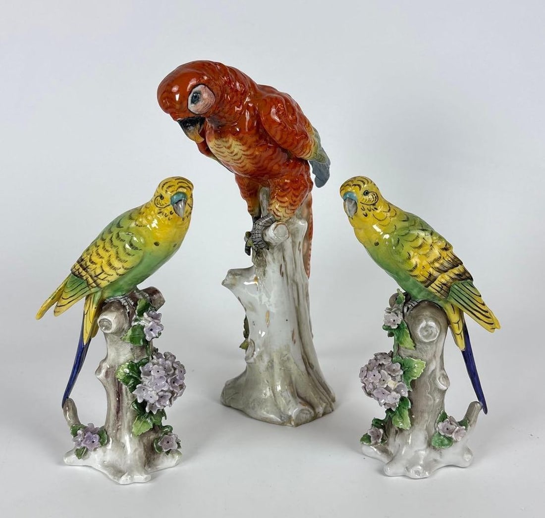 THREE VINTAGE NAPLES PORCELAIN PARROT PARAKEET FIGURES ITALY CAPODIMONTE STYLE: A trio of porcelain parrots marked in the Capodimonte tradition. Dimensions of largest: 9" h x 7" Maker: Naples, Capodimonte Provenance: A New York Collector Notes: Although care is taken to photog