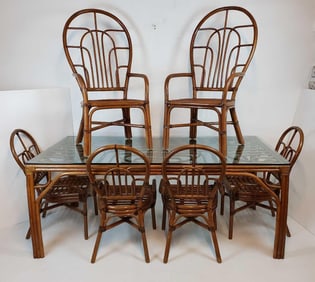 VINTAGE RATTAN GLASS TOP DINING TABLE AND SIX CHAIRS IN THE STYLE OF BROWN JORDAN