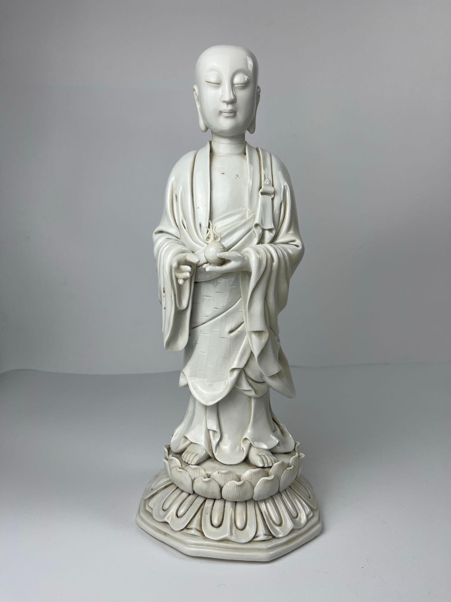 BLANC DE CHINE MONK ON LOTUS HOLDING ORB (1 of 7)