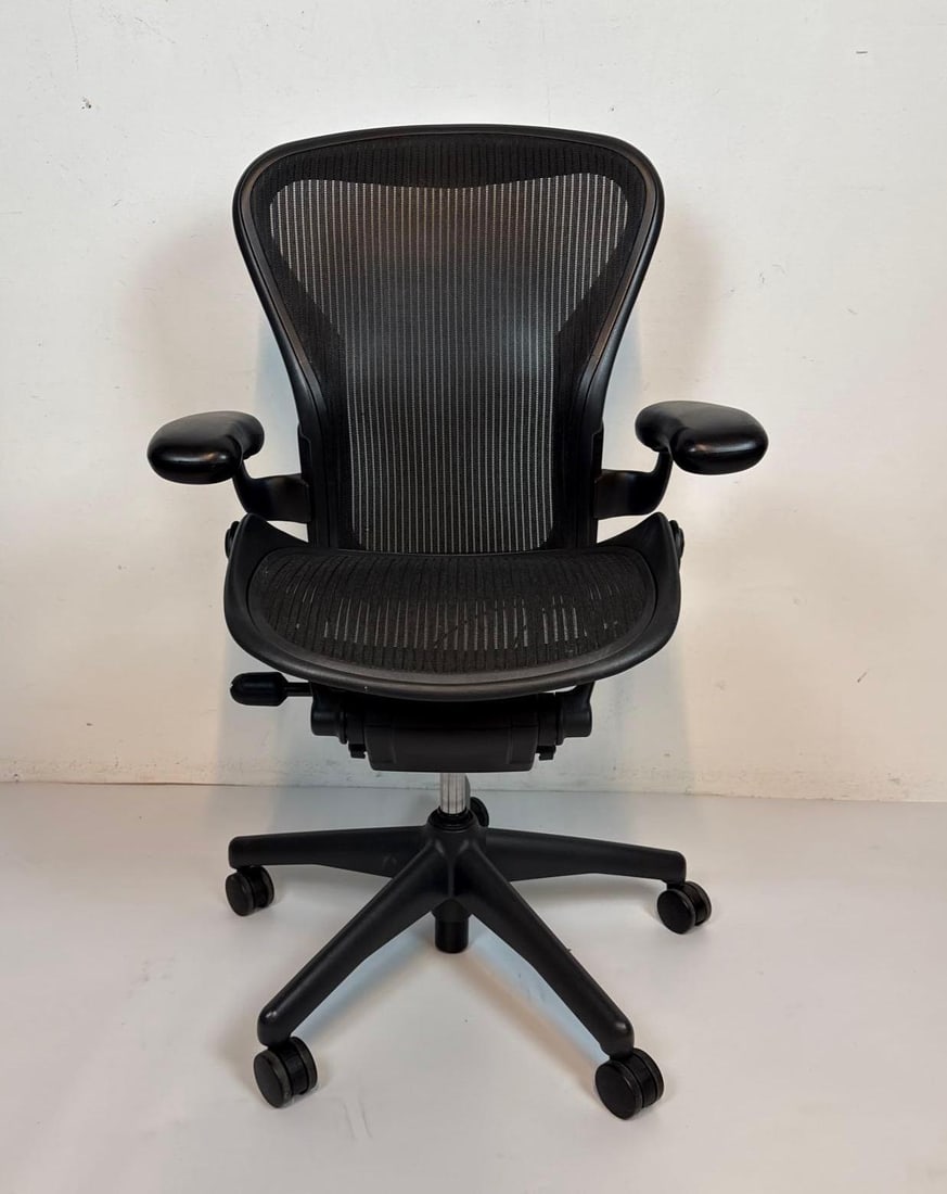 HERMAN MILLER AERON CHAIR SIZE B: Black Aeron Chair Size B. Dimensions 41.5"H X 26"W X 24"D Artist or Maker: Herman Miller Notes: Although care is taken to photograph and describe the item, absence of a condition report do