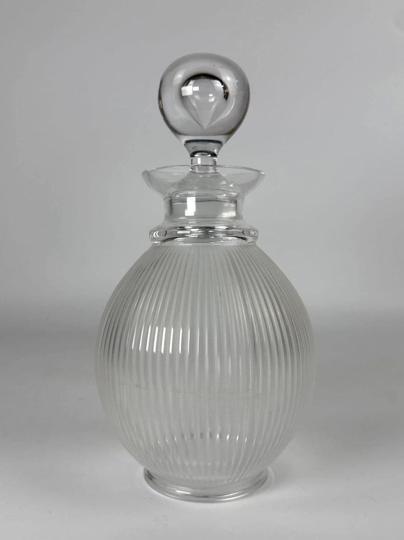 LALIQUE LANGEAIS DECANTER AND STOPPER: clo Lalique Crystal "Langeais" Decanter and Stopper Dimensions: 10” x 5” dia Artist or Maker: Lalique Provenance: From a NYC Collector. Notes: Although care is tak