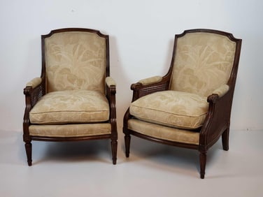 PAIR OF LOUIS XVI STYLE CARVED WALNUT CANED BERGERES