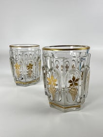 PAIR OF CHARLES X BACCARAT STYLE GILT GRAPE AND VINE CUPS