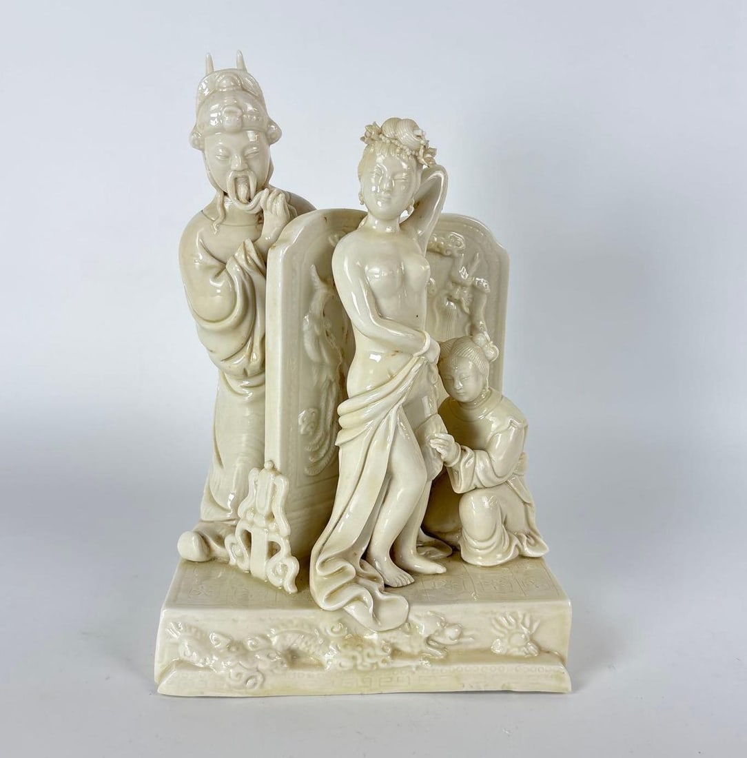 RARE BLANC DE CHINE DEHUA PORCELAIN: COURT LADY AT HER TOILETTE WITH ATTENDANTS: A molded Blanc de Chine figural group depicts an elegantly draped lady at her intimate bathing or "toilette" ritual, attended by a servant. Dimensions: 9" h x 6" x 5" Maker: Unknow