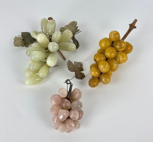 GROUP OF THREE CARVED STONE GRAPES CLUSTERS: JADE, QUARTZ, AND ALABASTER/AGATE FRUIT DECORATION