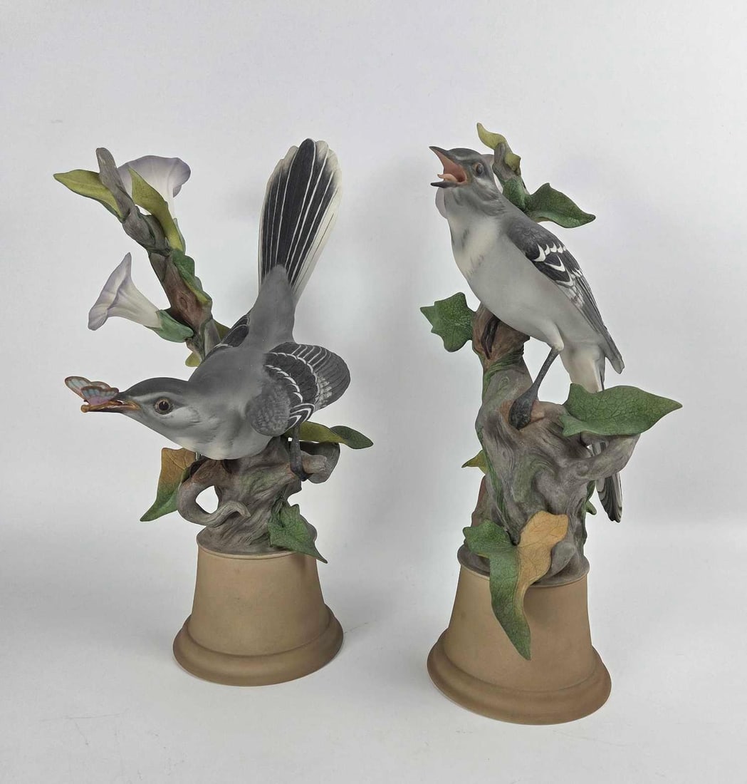 PAIR OF EDWARD MARSHALL BOEHM LIMITED EDITION BISQUE PORCELAIN MOCKINGBIRDS ON BLOSSOMING BINDWEED: A pair of bird-themed sculptures Dimensions: 10.75"h and 7.75"h Maker: Boehm Provenance: The Estate of Joseph Rodano Notes: Although care is taken to photograph and describe the item, absen