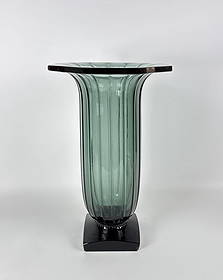 LARGE DAUM FRANCE POST-WAR MODERNIST CRYSTAL VASE: A large, French vase by Daum, crafted from heavy clear crystal with a substantial base and a simple, geometric form characteristic of 20th-century Modernist design. Dimensions: 16" h x 9.25"