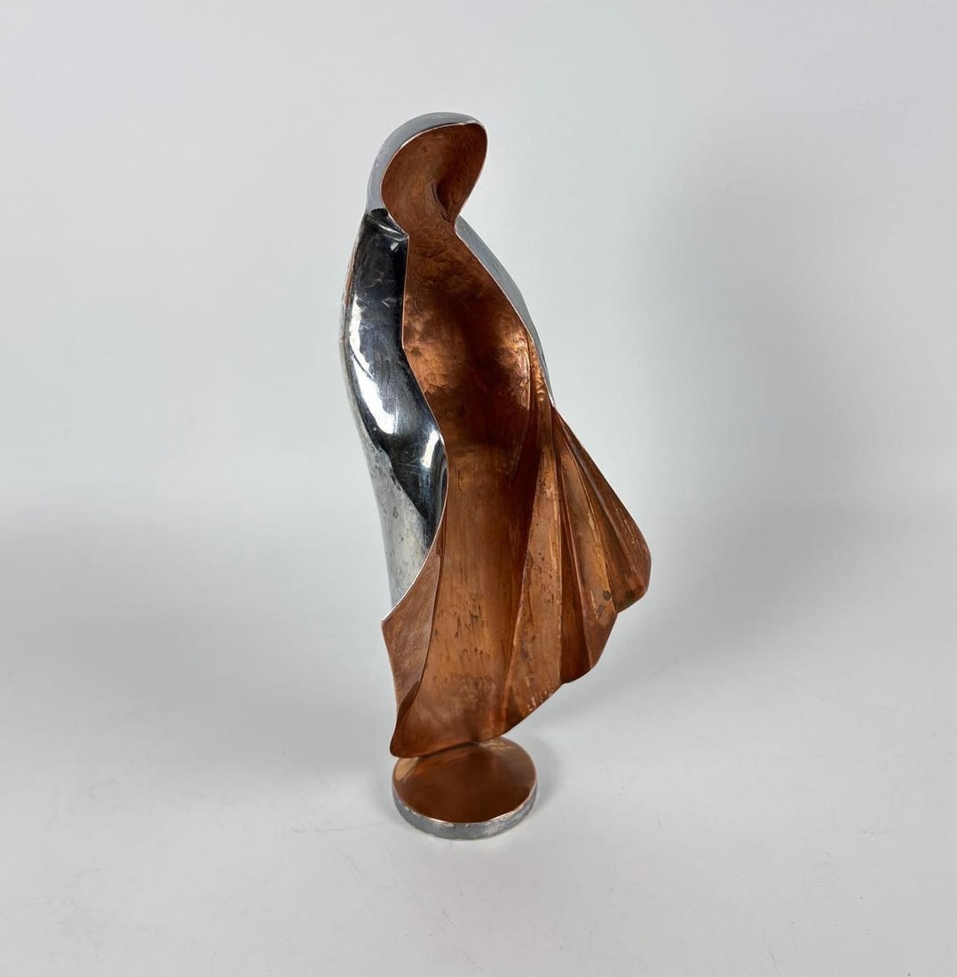 CASTILLO SILVER PLATED HAMMERED COPPER -MADONNA - MID CENTRURY - VIRGIN MARY SCULPTURE: A mid-century religious sculpture of the Virgin Mary by the Los Castillo workshop of Taxco, Mexico, made of hammered copper with a silver-plated finish. Dimensions: 9.5" h x 4.25" dia Maker: