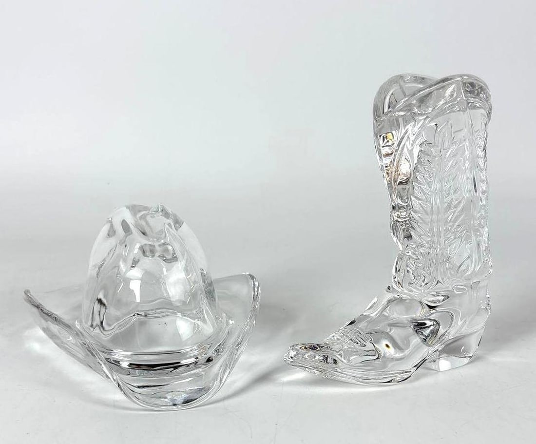 RALPH LAUREN COWBOY BOOT AND HAT PAPERWEIGHT LOT: Two crystal western paperweights, one shaped like a cowboy boot with decorative etching and one shaped like a cowboy hat. Dimensions: 5"H x 4"W x 1.5"D Maker: Ralph Lauren Provenance: T