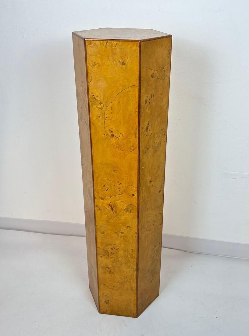 VINTAGE ITALIAN BURLED WOOD HEXAGONAL PEDESTAL OR DISPLAY COLUMN: A tall, hexagonal Italian pedestal clad in burled wood veneer. Dimensions: 40" h X 15" dia Maker: Unknown Provenance: The Estate of Joseph Rodano Notes: Although care is taken to photograph