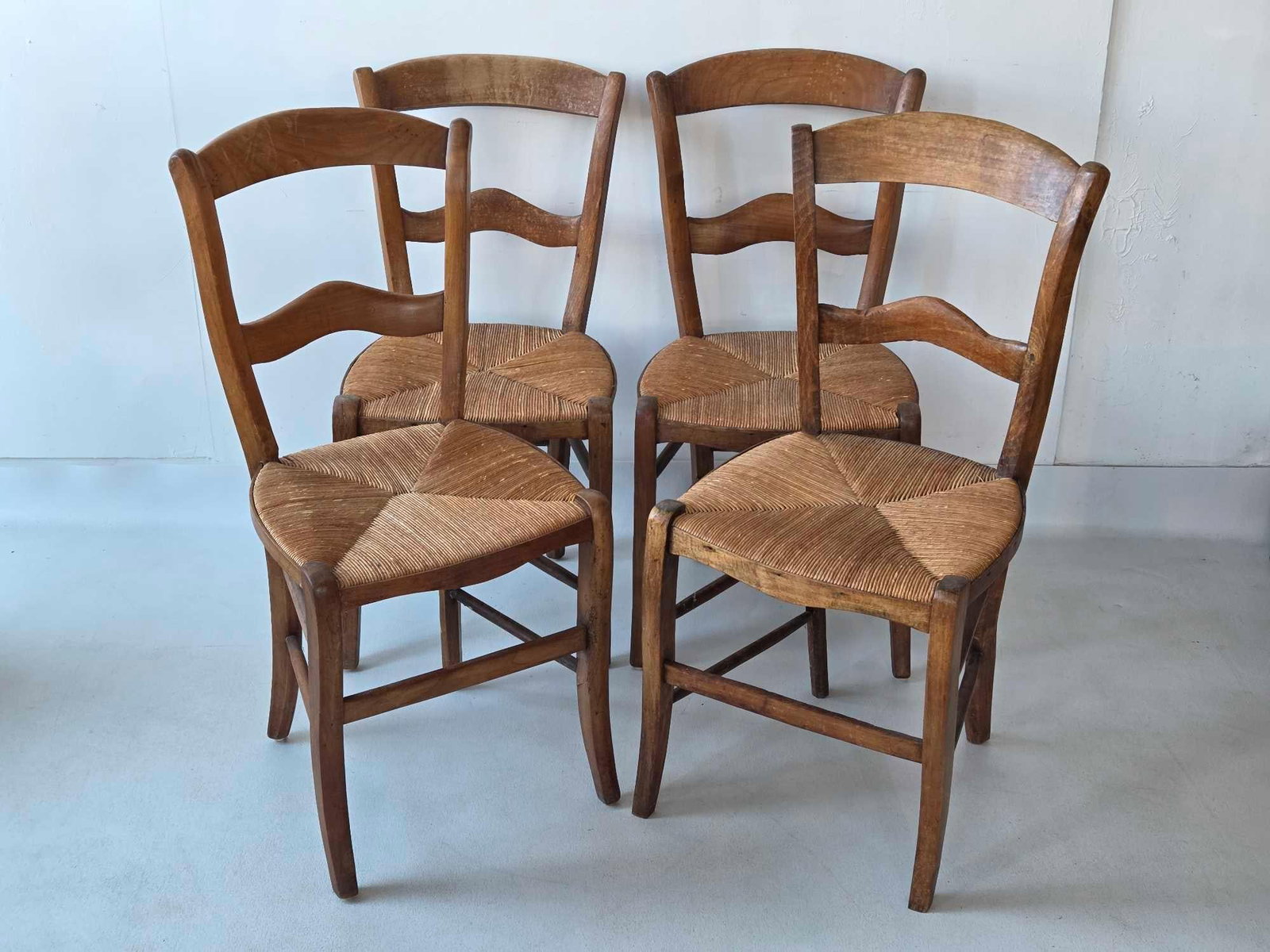 SET OF FOUR ANTIQUE RUSH SEAT CHAIRS: 4 chairs Dimensions: 33.75"h x 16"w x 18"d Maker: Unknown Provenance: A New York Collector Notes: Although care is taken to photograph and describe the item, absence of a condition re