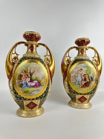 EXCEPTIONAL PAIR OF ROYAL VIENNA STYLE HAND-PAINTED PORCELAIN URNS/VASES WITH HEAVY GILDING
