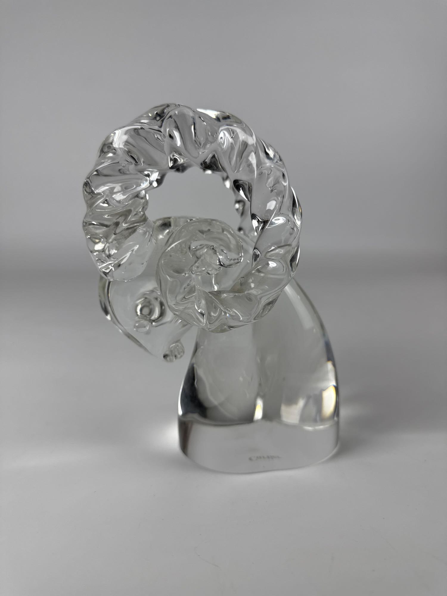 CARTIER BY ARCHIMEDE SEGUSO CRYSTAL GLASS RAM HEAD SCULPTURE: A clear crystal glass figure of a ram's head, created by Archimede Seguso for Cartier. Approximate Dimensions: 5”x6”x7” tall Maker: Archimede Seguso Murano for Cartier Provenance: F