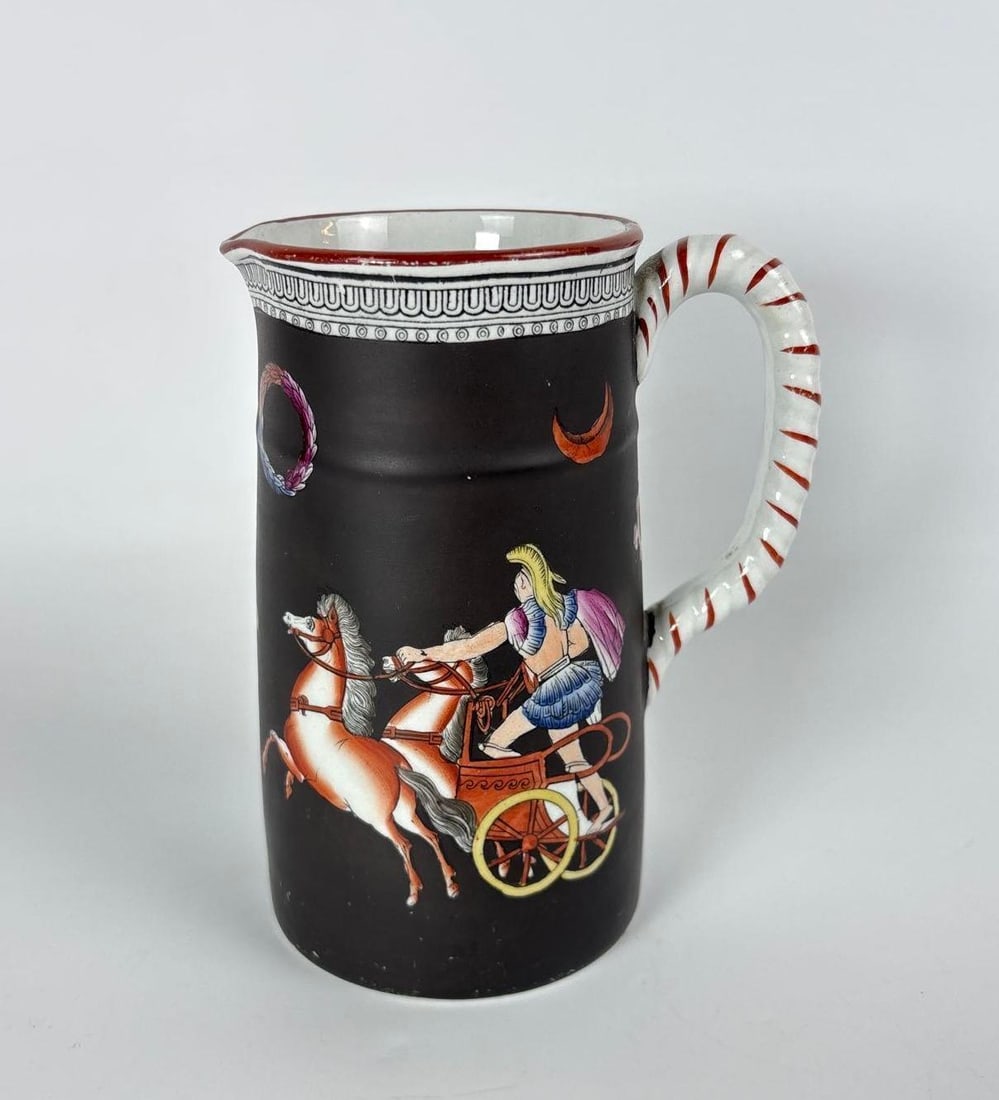 ANTIQUE ENGLISDH CHARIOT SCENE ENAMEL PITCHER: Chariot themed pitcher Dimensions: 6" h x 4.5" dia Maker: Unknown Notes: Although care is taken to photograph and describe the item, absence of a condition report does not imply perfect condit