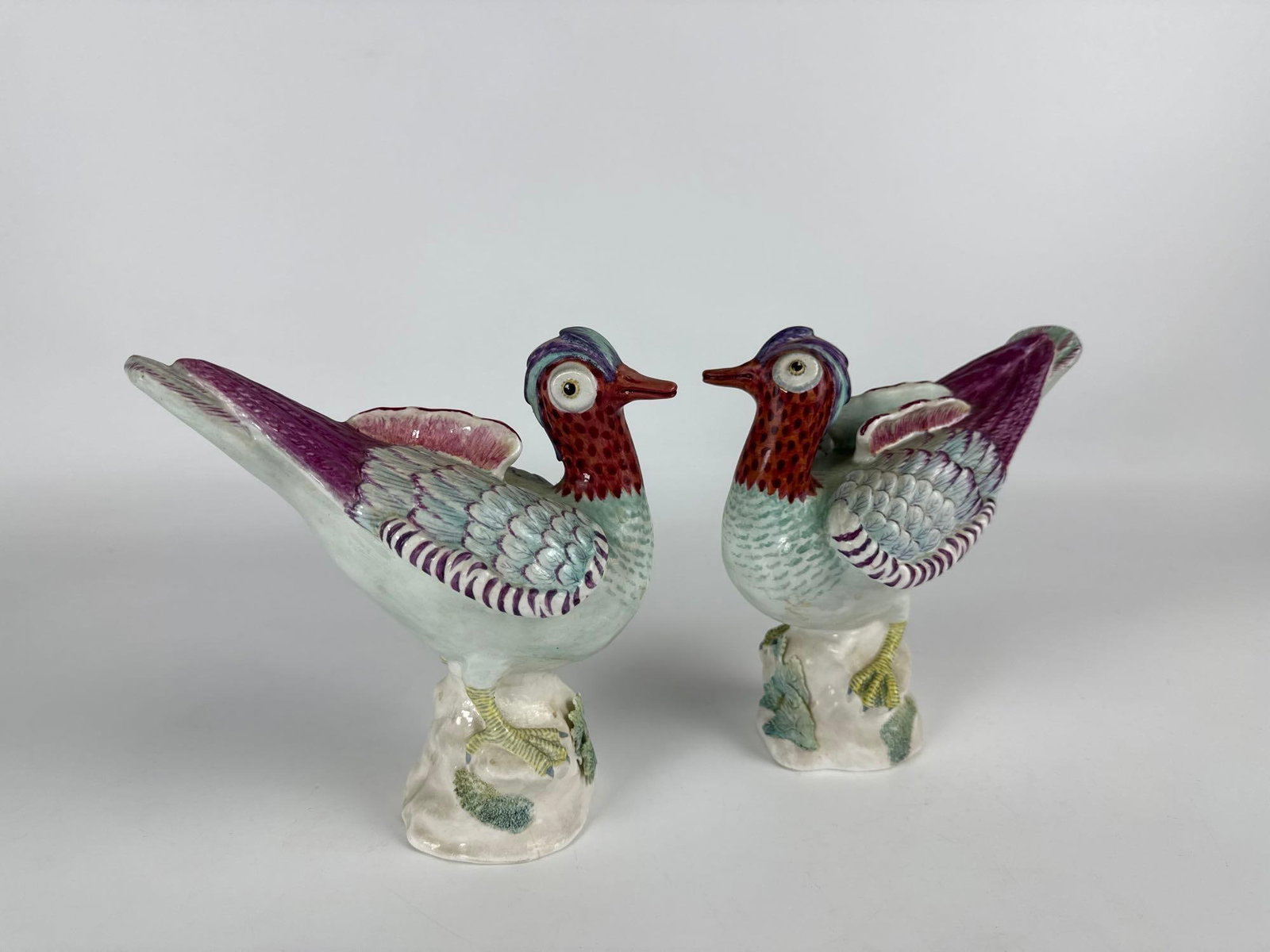 PAIR VINTAGE CROWN STAFFORDSHIRE BONE CHINA CHINESE TEAL BIRD FIGURES BY M. DOUBELL MILLER: This pair of hand-painted bone china bird figures, modeled by M. Doubell Miller for Crown Staffordshire, depicts Chinese Teal ducks and bears factory markings. Approximate Dimensions: 7" L X 7"