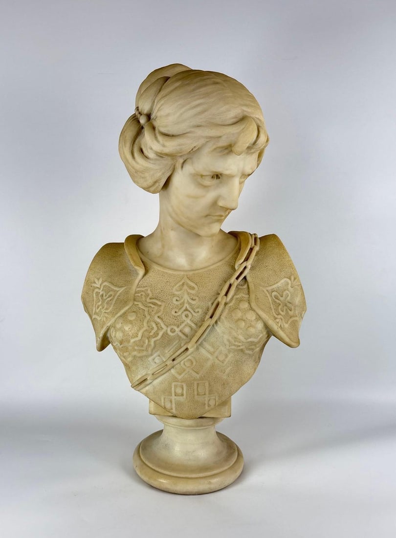 RENAISSANCE REVIVAL ART NOUVEAU STYLE MARBLE BUST OF YOUNG WOMAN: Classic hand-carved white marble depiction of a maiden in ornamental patterned bodice on a circular pedestal base. Approximate Dimensions: 28"H x 15" x 9" Artist or Maker: Unknown Prove