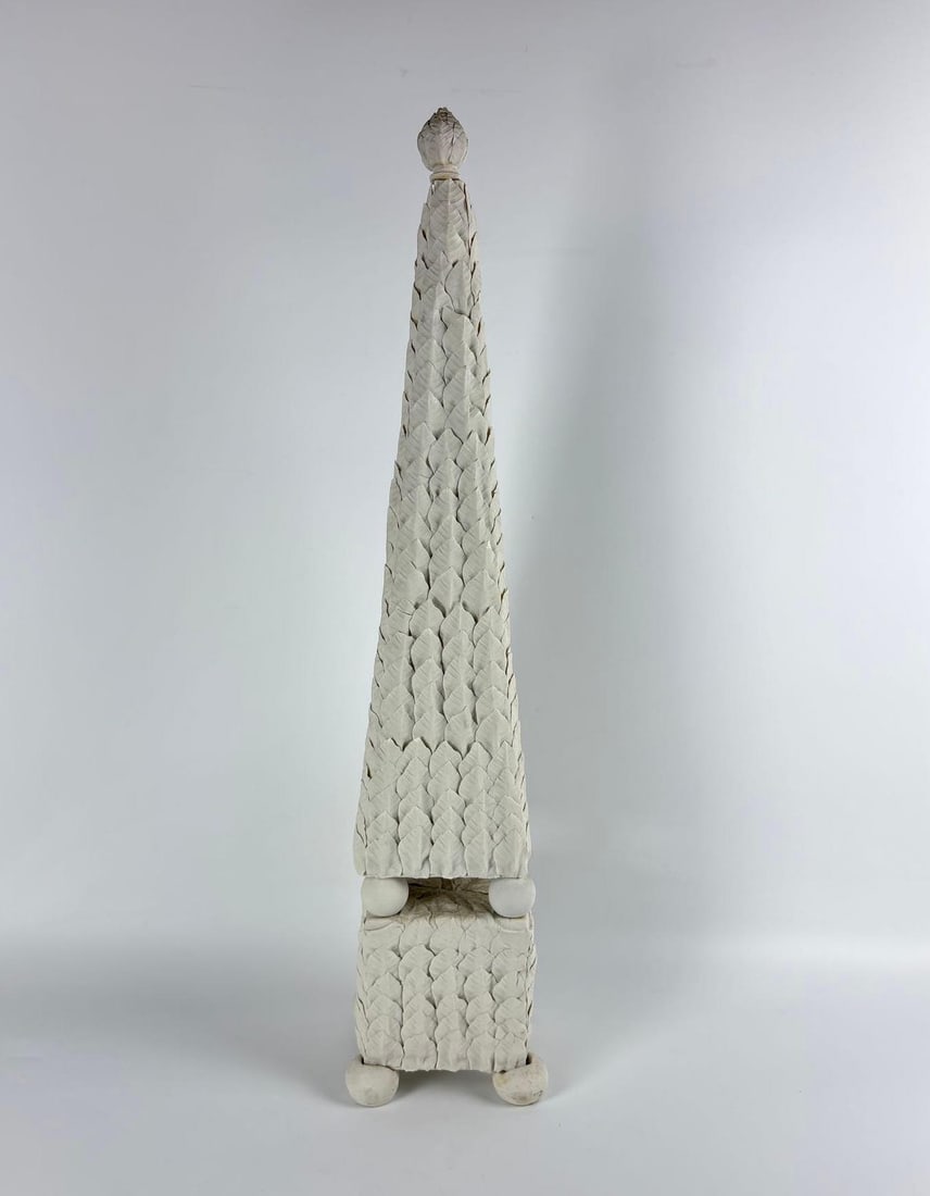 UNIQUE VINTAGE UNGLAZED WHITE CERAMIC LEAF TOPIARY OBELISK: Hand-sculpted white stoneware decorative pylon with all-over raised acanthus leaf carvings and a natural matte bisque finish Approximate Dimensions: 5” x 5” x 28”T Artist or Maker:
