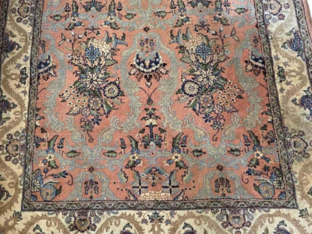 VINTAGE PERSIAN MAHAL STYLE WOOL RUG: *A hand-knotted, rectangular wool area rug featuring a repeating floral motif in muted salmon and blue tones with corresponding palmette and vine designs. Dimensions: 6'-2"L x 4'-2"W Maker: Unknown