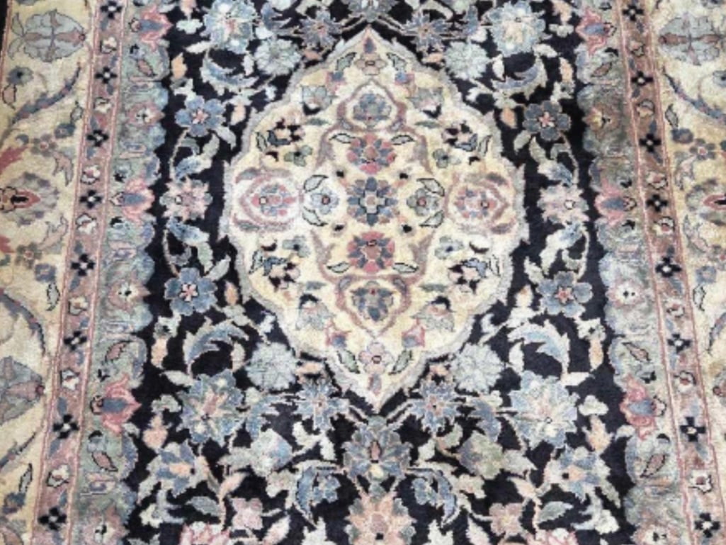 HAND KNOTTED VINTAGE PERSIAN FLORAL MOTIF AREA RUG: *A hand-knotted rectangular wool area rug with a large central medallion and dense floral motifs. Dimensions: 6'L x 4'W Maker: Unknown Provenance: A New York Collector Notes: Althou