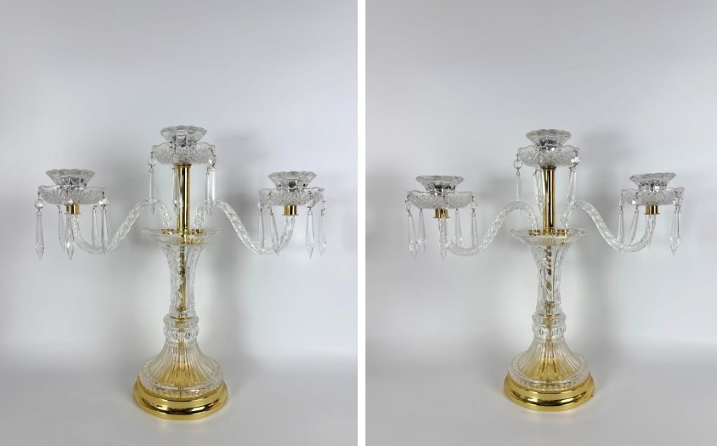 PAIR OF WATERFORD STYLE CRYSTAL AND GILT BRONZE CANDELABRAS: *Pair of Waterford style crystal light candelabras Dimensions: 18.25”h x 19”w x 7”d Maker: Waterford Notes: Although care is taken to photograph and describe the item, absence of a