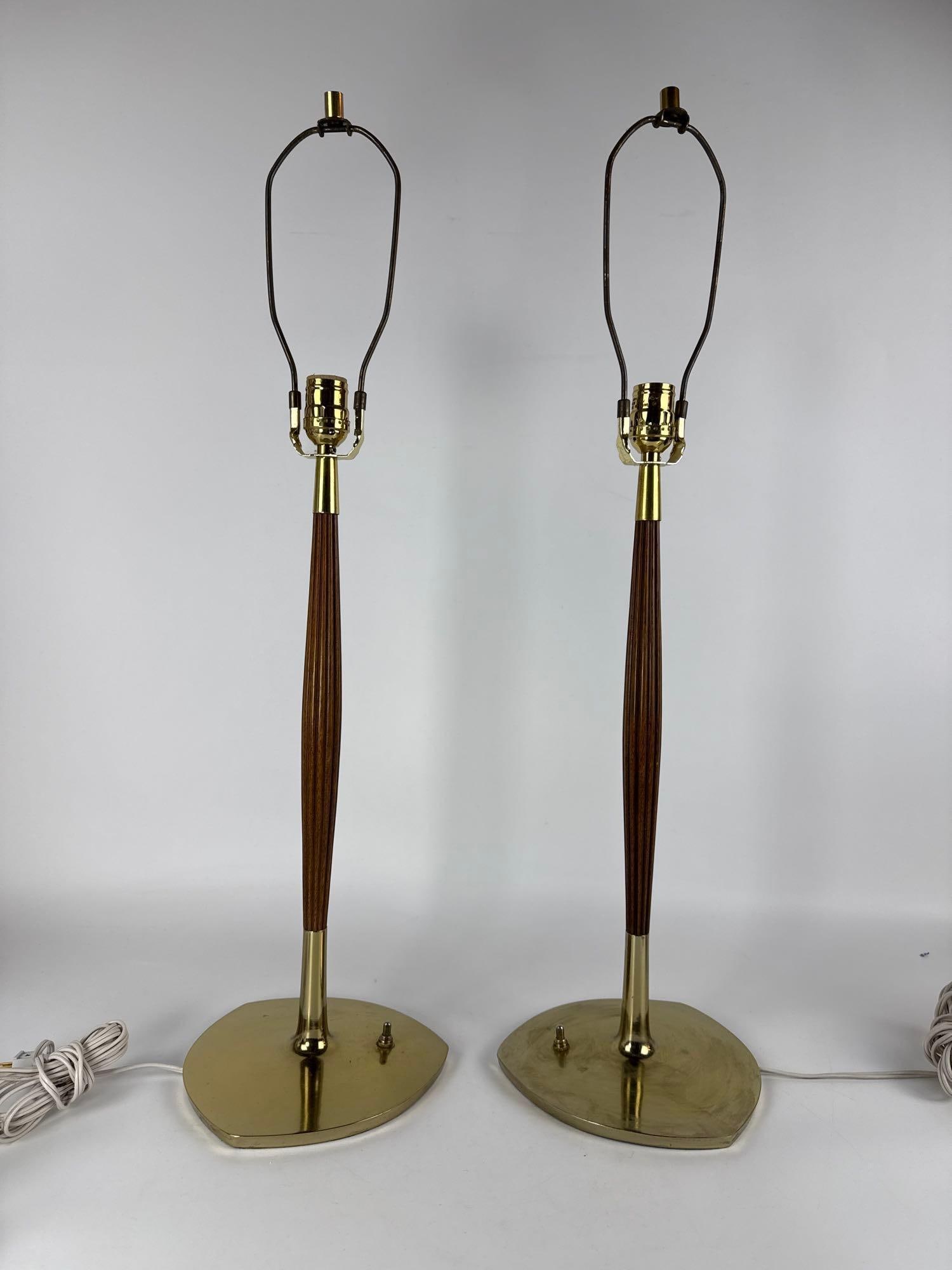 PAIR OF SCULPTURAL MID-CENTURY MODERN WALNUT AND BRASS TABLE LAMPS: *These vintage 1960s American-made lighting fixtures combine solid walnut bodies in organic, biomorphic shapes with polished brass accents and hardware. Approximate Dimensions: 30"h Artist or Maker: U
