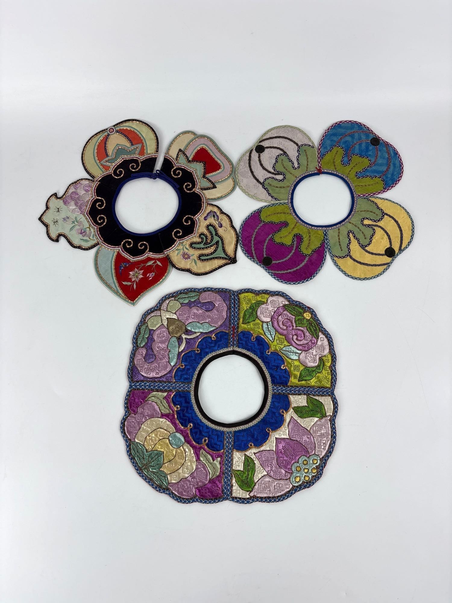 LOT OF THREE ANTIQUE CHINESE EMBROIDERED SILK CHILD’S CLOUD COLLARS, YUNJIAN: *This lot contains three antique Chinese silk embroidered children's collars, known as Yunjian or Cloud Collars, which feature multiple scalloped panels with fine needlework and auspicious motifs. Ap