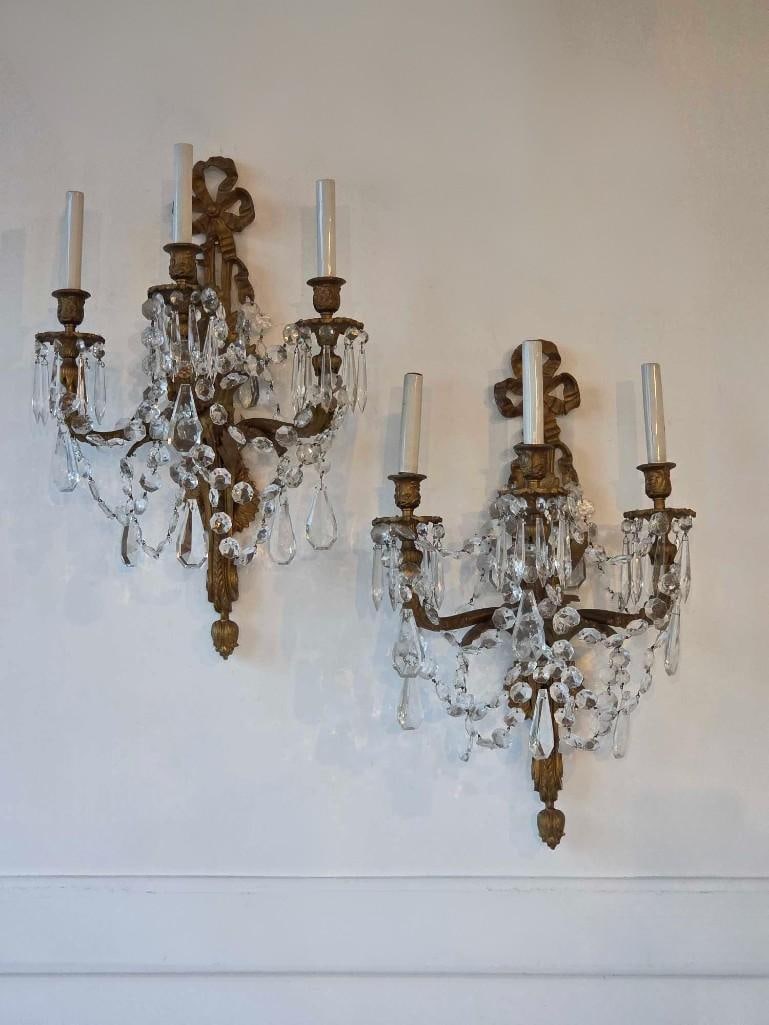 PAIR OF GILT BRONZE THREE LIGHT CRYSTAL WALL SCONCES (1 of 17)