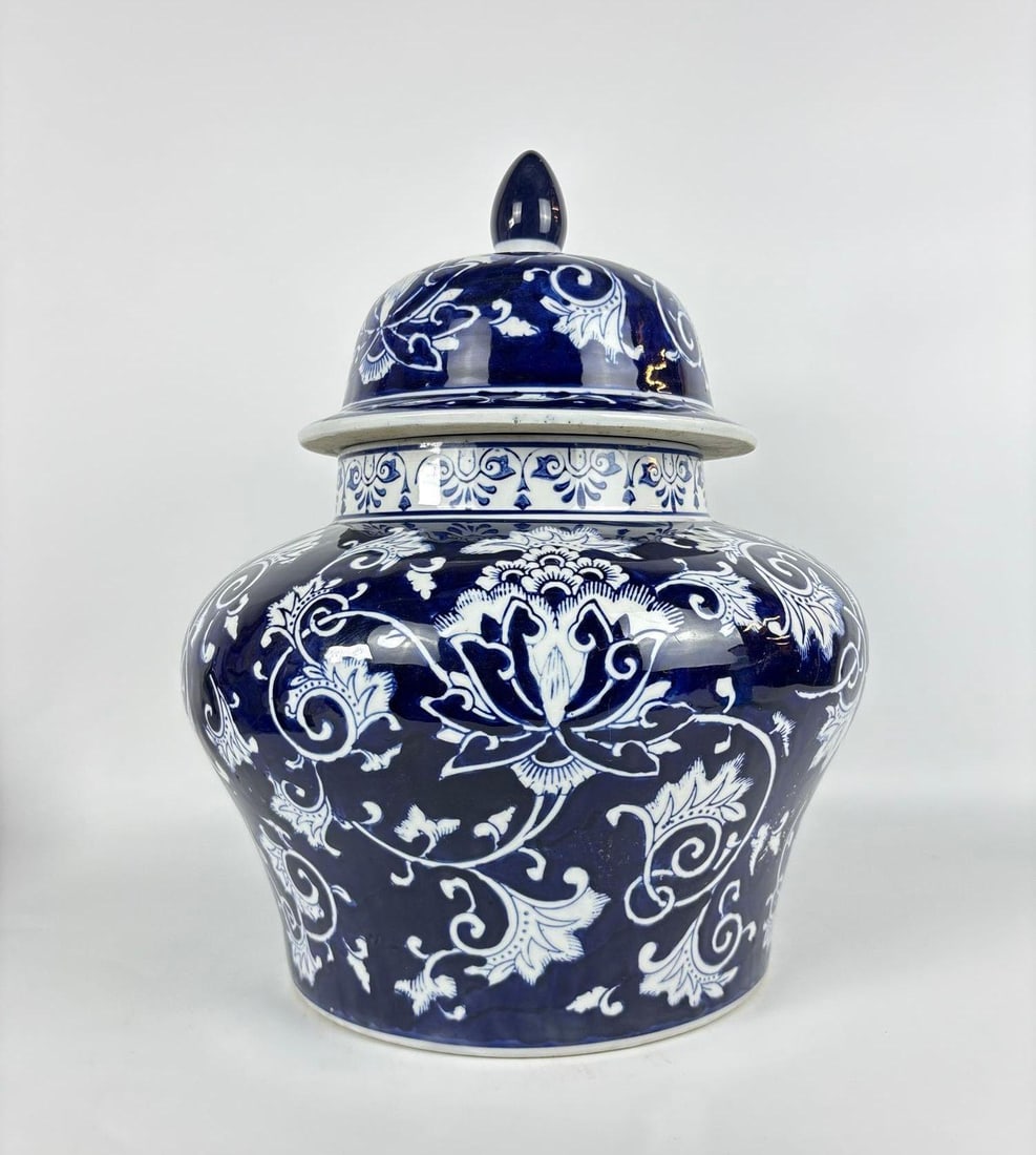 SUPER SIZED VINTAGE STYLE BLUE AND WHITE PORCELAIN GINGER JAR: A large scale hand painted cobalt blue and white floral and lotus motif ginger jar with domed lid. Approximate Dimensions: 17.5"h x 13"dia Artist or Maker: Unknown Provenance: From a New York Collecto