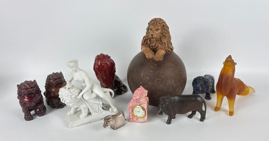 LION FIGURINE LOT VINTAGE LION FIGURINE MULTI-MATERIAL COLLECTOR LOT INCL DANSK, BACCARAT: An assortment of lion figurines comprising iridescent porcelain, silver-plated metal, frosted glass, carved stone Rhodochrosite, and white bisque ceramic decorative objects. Note: Baccarat lion with c