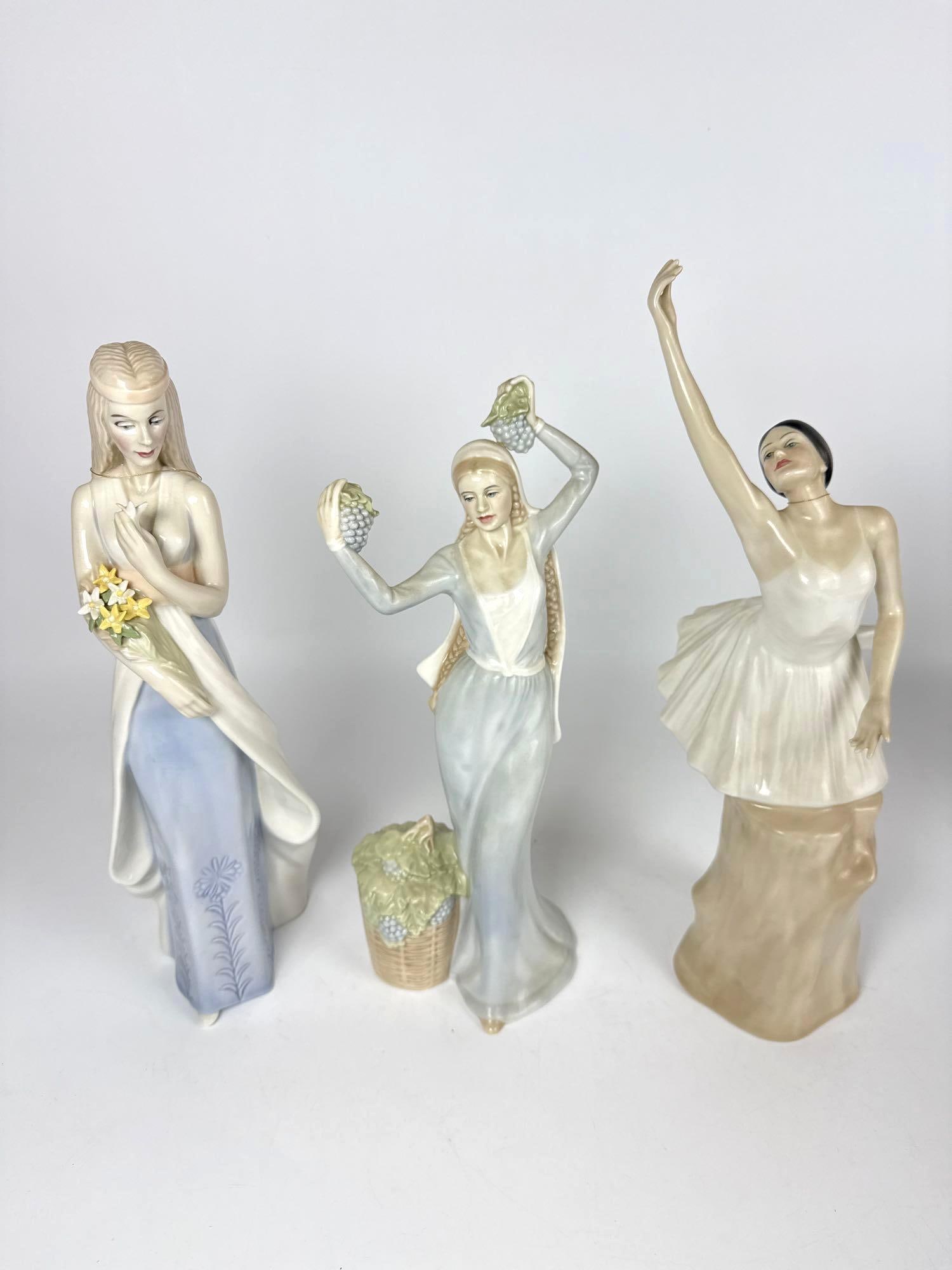 TRIO OF ROYAL DOULTON REFLECTIONS FIGURINES INCL SWEET BOUQUET, AUTUMN GLORY, & THE BALLERINA: A trio of handmade, hand painted, pastel colored porcelain figures including Sweet Bouquet, Autumn Glory & The Ballerina from the Reflections line. Tallest Approximate Dimensions: 14”H x 6&rdqu
