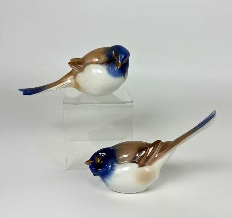 BING & GRONDAHL PORCELAIN TITMOUSE BIRD FIGURINES: A duo of hand-painted Danish porcelain songbirds depicted in "Optimist" and "Pessimist" poses with characteristic blue-gray and tan underglaze plumage. Approximate Dimensions: 3.5&rdq