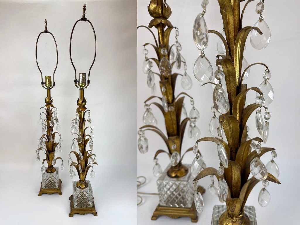 PAIR OF BRONZE AND CRYSTAL LAMPS: A pair of vintage table lamps featuring gilded bronze bases in a leaf-and-stalk motif adorned with hanging crystal prisms and set upon faceted glass blocks. Stamped 7680 on bottom. Approximate Dimens
