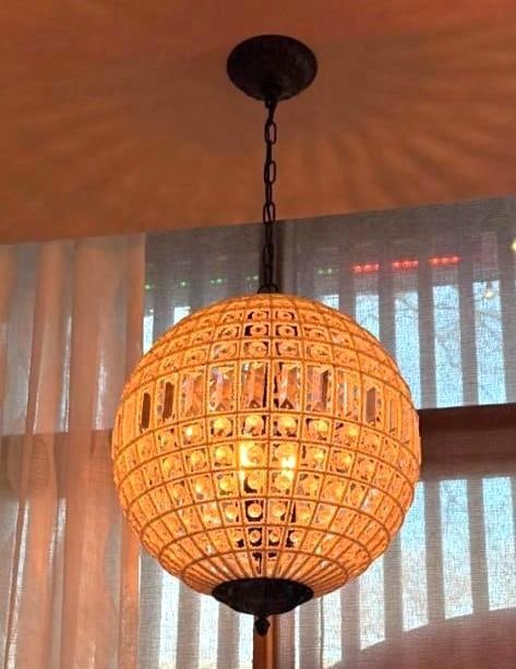 CRYSTAL AND MICROBEAD EMBELLISHED THREE LITE SPHERE PENDANT (1 OF 4): An orb hanging light fixture with a metal grid frame intertwined with delicate microbeads and faceted crystal accents. Approximate Dimensions: 16.5"DIA Maker: Unknown Provenance: From a New York Co