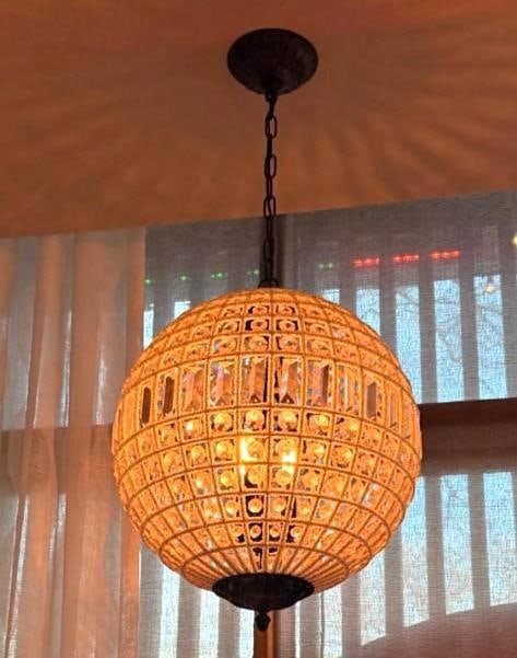 CRYSTAL AND MICROBEAD EMBELLISHED THREE LITE SPHERE PENDANT CHANDELIER (2 OF 4): An orb hanging light fixture with a metal grid frame intertwined with delicate microbeads and faceted crystal accents. Approximate Dimensions: 16.5"DIA Maker: Unknown Provenance: From a New York Co