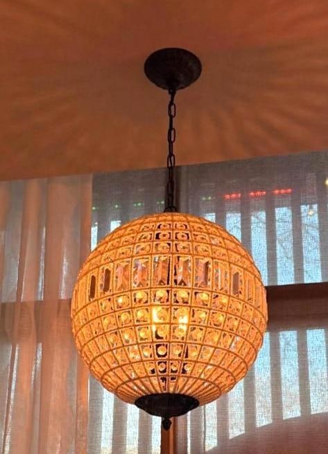 CRYSTAL AND MICROBEAD EMBELLISHED THREE LITE SPHERE PENDANT CHANDELIER (3 OF 4): An orb hanging light fixture with a metal grid frame intertwined with delicate microbeads and faceted crystal accents. Approximate Dimensions: 16.5"DIA Maker: Unknown Provenance: From a New York Co