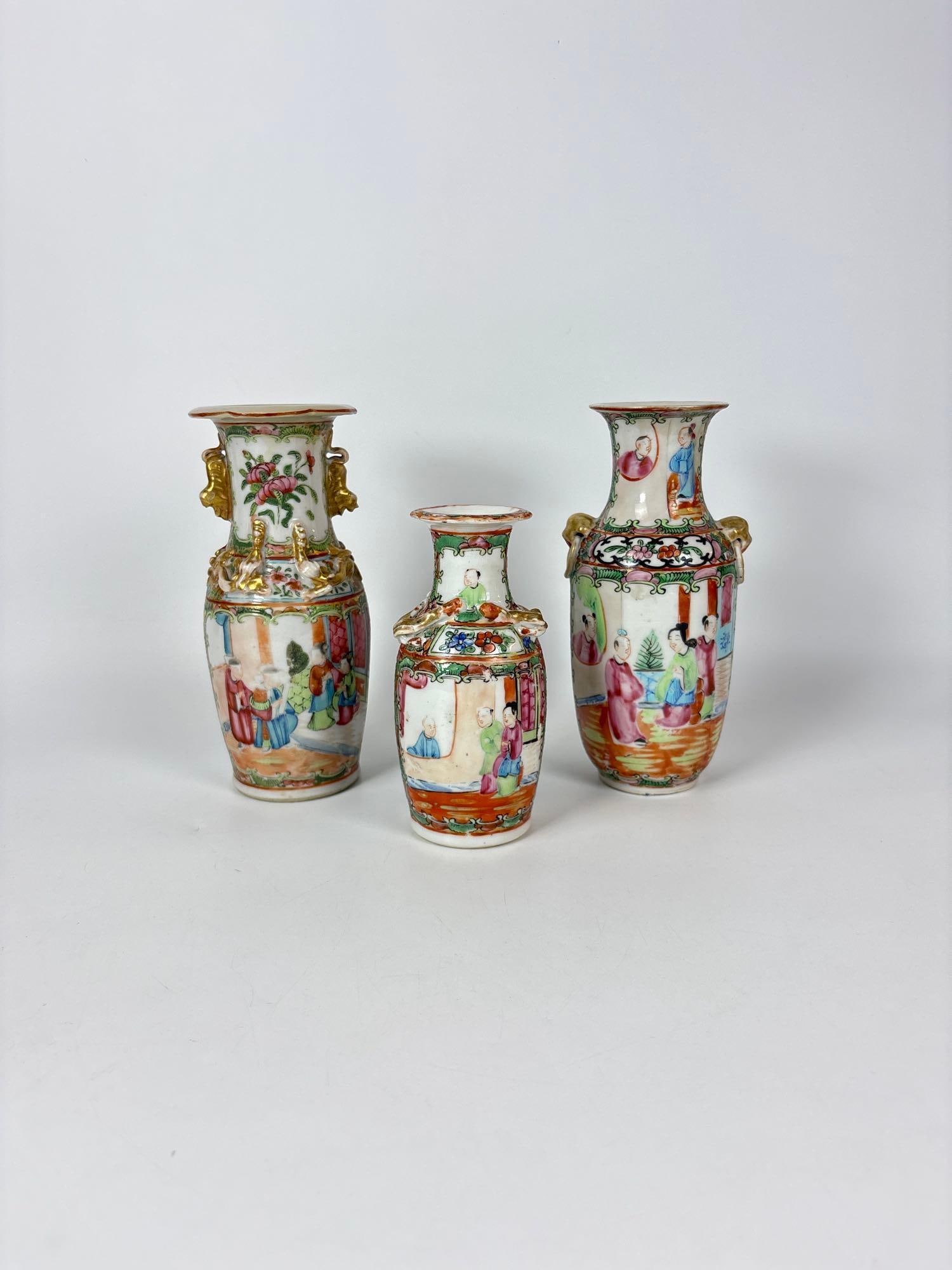 THREE CHINESE ROSE MEDALLION PORCELAIN VASES WITH GILT ACCENTS: Trio of miniature hand-painted export porcelain vessels depicting domestic court scenes and floral motifs Approximate Dimensions: 7.5" h Artist or Maker: Unknown Provenance: Purchased during the p