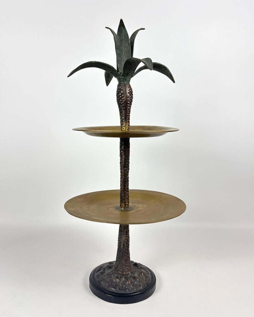 VINTAGE PALM TREE FIGURAL BRASS AND BRONZE TWO-TIER EPERGNE: Decorative tropical-themed tabletop centerpiece with a textured bronze-finish palm tree trunk supporting two circular brass trays and topped with a spreading frond finial. Approximate Dimensions: 21&r