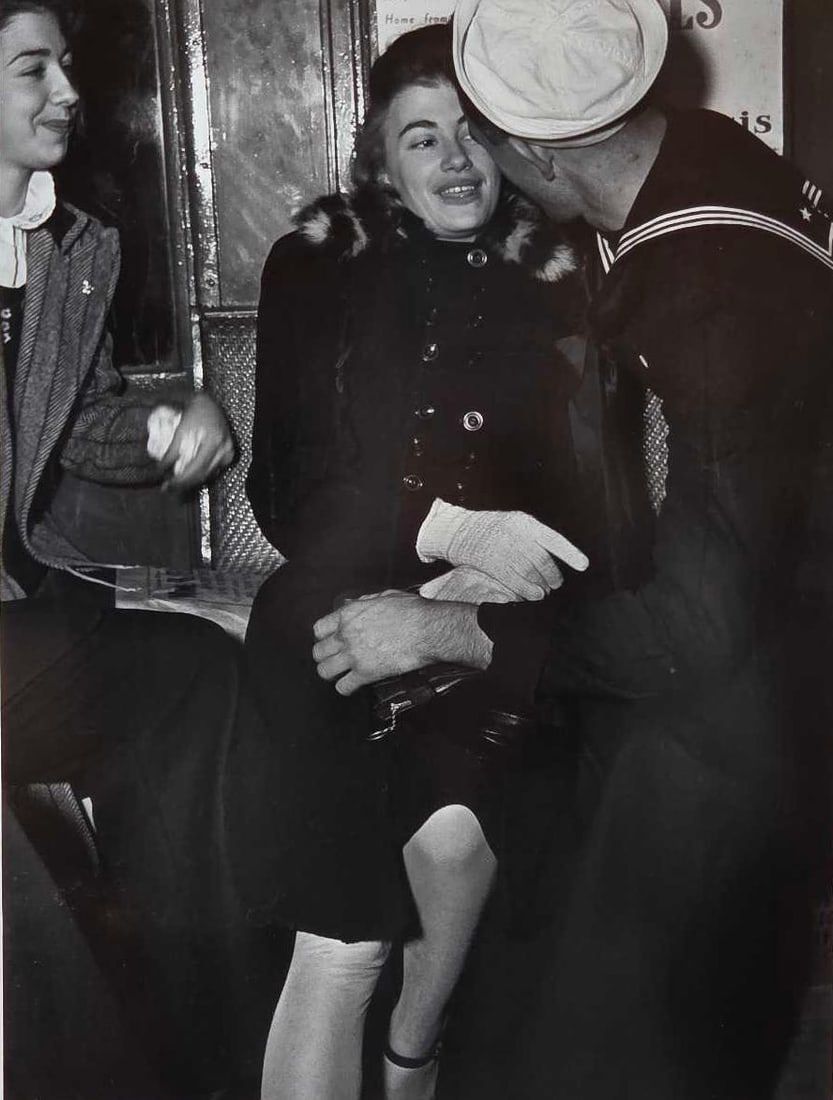 LOU STOUMEN VINTAGE SIGNED PHOTOGRAPH "SAILOR AND GIRL ON SUBWAY" 1940: *Black and white print depicting an intimate urban moment on a New York City train signed by the Academy Award winning photographer Approximate Dimensions: 12" x 9" image;,21" x 17" o