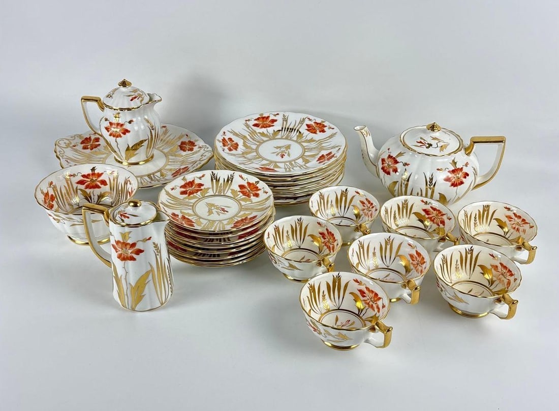 ROYAL CHELSEA ENGLAND TEA SET: *Fine English bone china service decorated with vibrant hand-painted orange floral blooms and intricate gilded foliage accents. Approximate Dimensions: largest 10"DIA Artist or Maker: Royal Chel