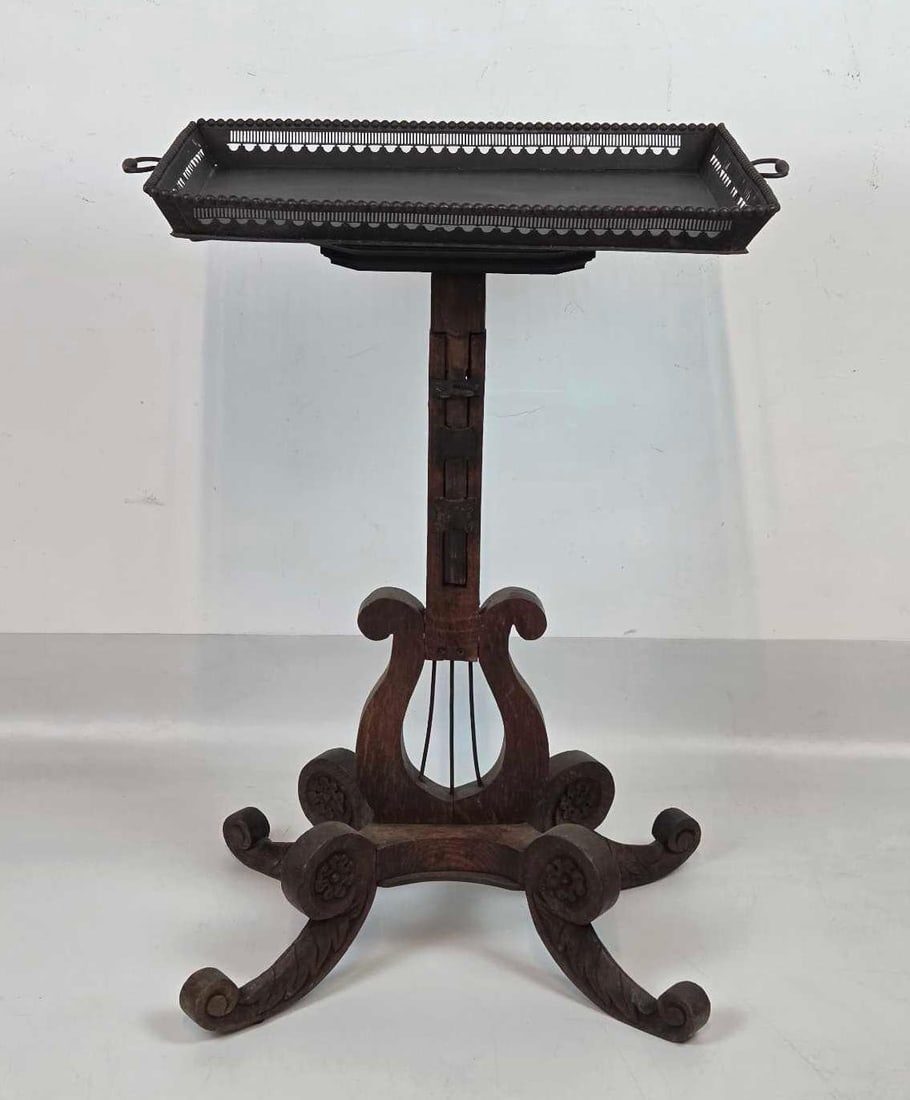 CARVED OAK ADJUSTABLE LYRE-BASE STAND WITH REMOVABLE TRAY: *Antique English-style carved oak music or reading stand with an adjustable height column, a lyre-form base on scrolled feet, and a removable black metal gallery tray with twin handles Approximate Dim