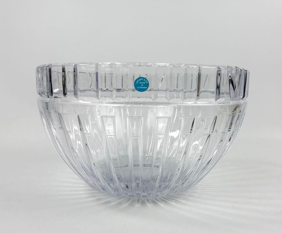 VINTAGE TIFFANY & CO. ATLAS CRYSTAL CENTERPIECE BOWL ROMAN NUMERALS: Substantial hand-cut lead crystal centerpiece bowl from the retired Atlas Collection featuring signature Roman numeral motif around the rim and fluted vertical cuts. Approximate Dimensions: 5.75&rdquo