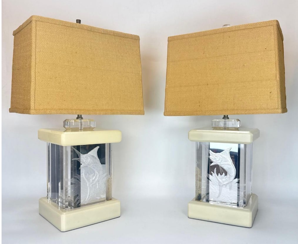 PAIR OF VINTAGE MIRRORED AND ETCHED MARLIN LUCITE LAMPS: Rectangular table lamps with internally etched marlin fish motifs, mirrored back panels, and cream-colored bases topped with textured burlap shades. NOTE: The Marlin is visible on only one side of the