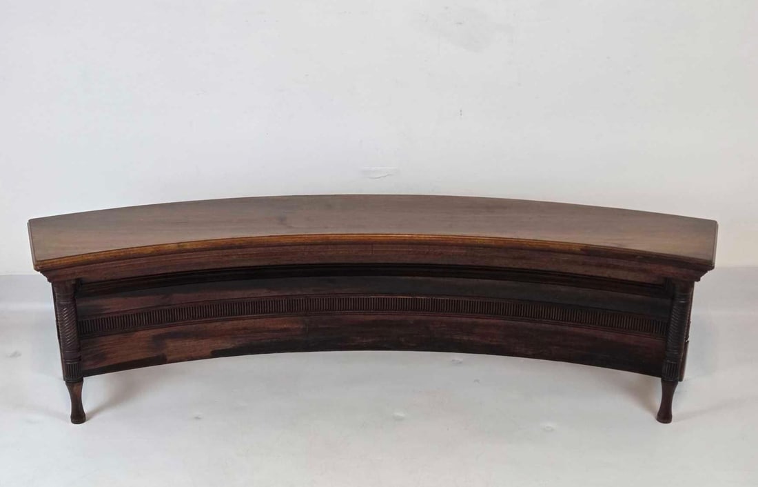 ANTIQUE CURVED MAHOGANY BENCH WITH TURNED LEGS AND RAISED PANELS (1 of 2): Exquisite 19th-century mahogany crescent-form bench with a reeded apron and elegant turned legs. Approximate Dimensions: 17.5"h x 66.25"w x 15.5"d Artist or Maker: Unknown Provenance: Fro