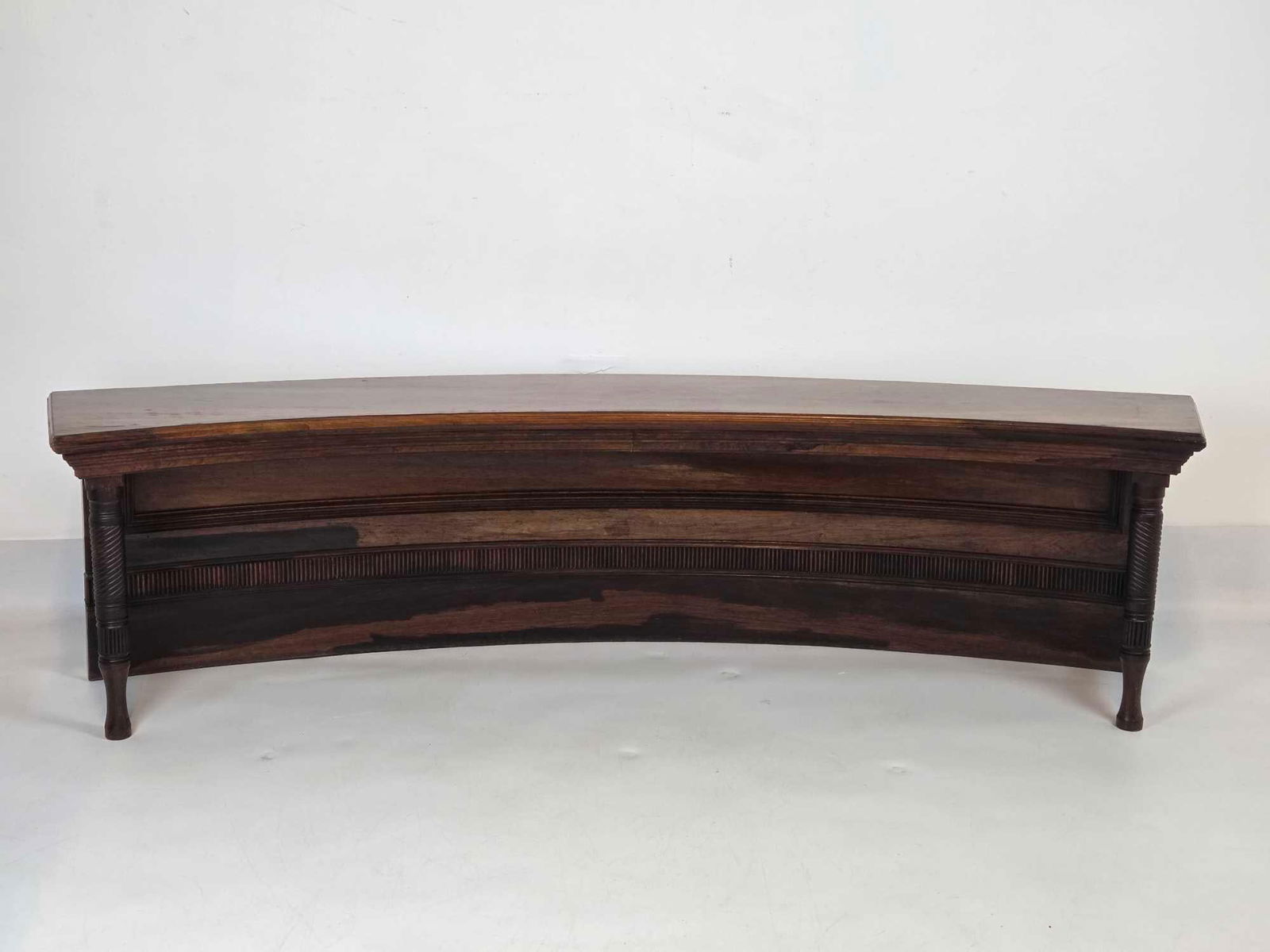 ANTIQUE CURVED MAHOGANY BENCH WITH TURNED LEGS AND RAISED PANELS (2 of 2): Exquisite 19th-century mahogany crescent-form bench with a reeded apron and elegant turned legs. Approximate Dimensions: 17.5"h x 66.25"w x 15.5"d Artist or Maker: Unknown Provenance: Fro