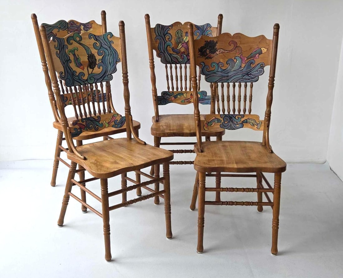 JOHN DINARO SET OF FOUR VINTAGE HAND PAINTED HIGH BACK CHAIRS: Four solid wood spindle back side chairs with custom artisan-painted mermaid and sea life illustrations Approximate Dimensions: 42.75"H x 17.75"W x 21"D Artist or Maker: John Dinaro Pro