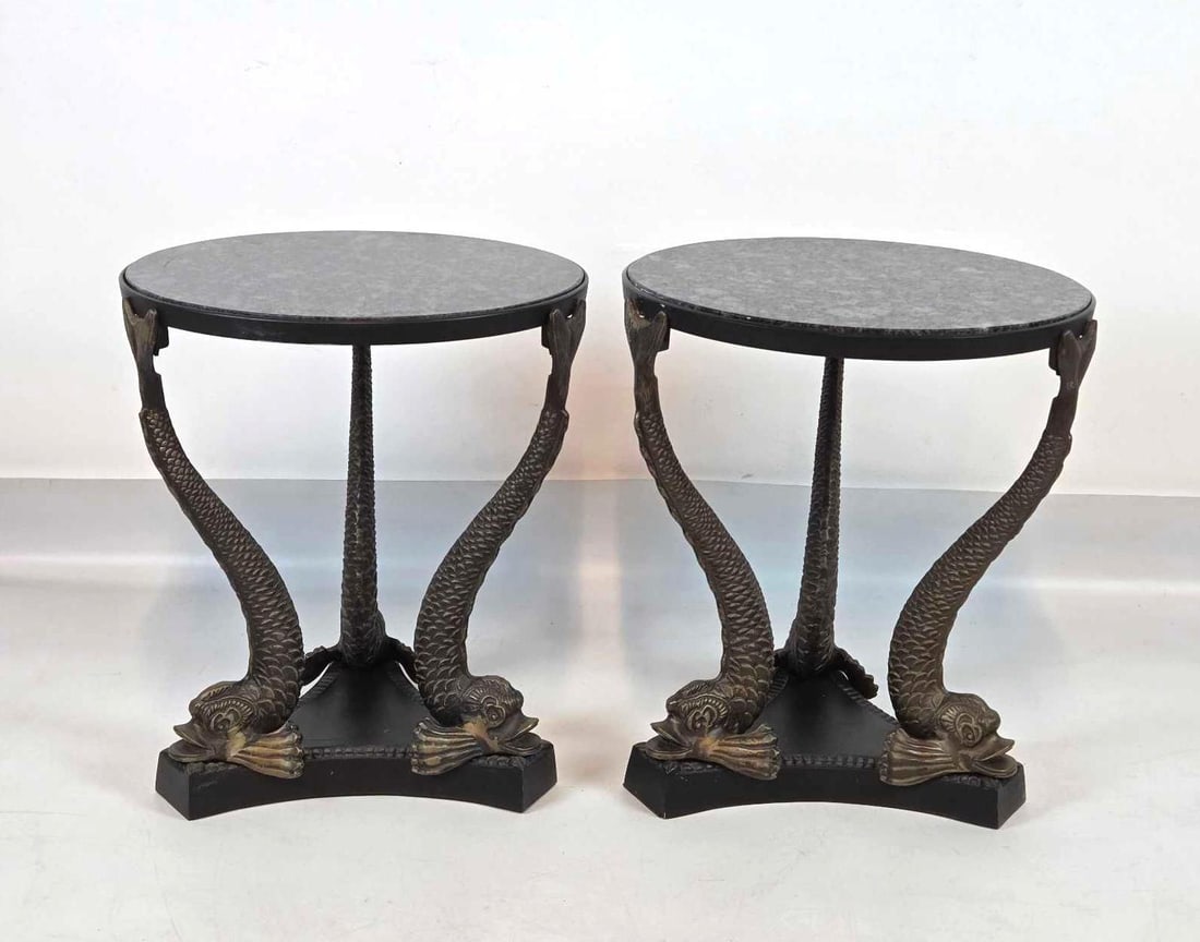 PAIR OF BRONZE TRIPLE DOLPHINS BASE GRANITE TOP ROUND SIDE END TABLES PEDESTALS: *Two circular grey stone surfaces supported by tripartite figural aquatic bronze pedestals on triangular plinth bases. Approximate Dimensions: 20.5"H x 18"Dia Artist or Maker: Unknown Prove