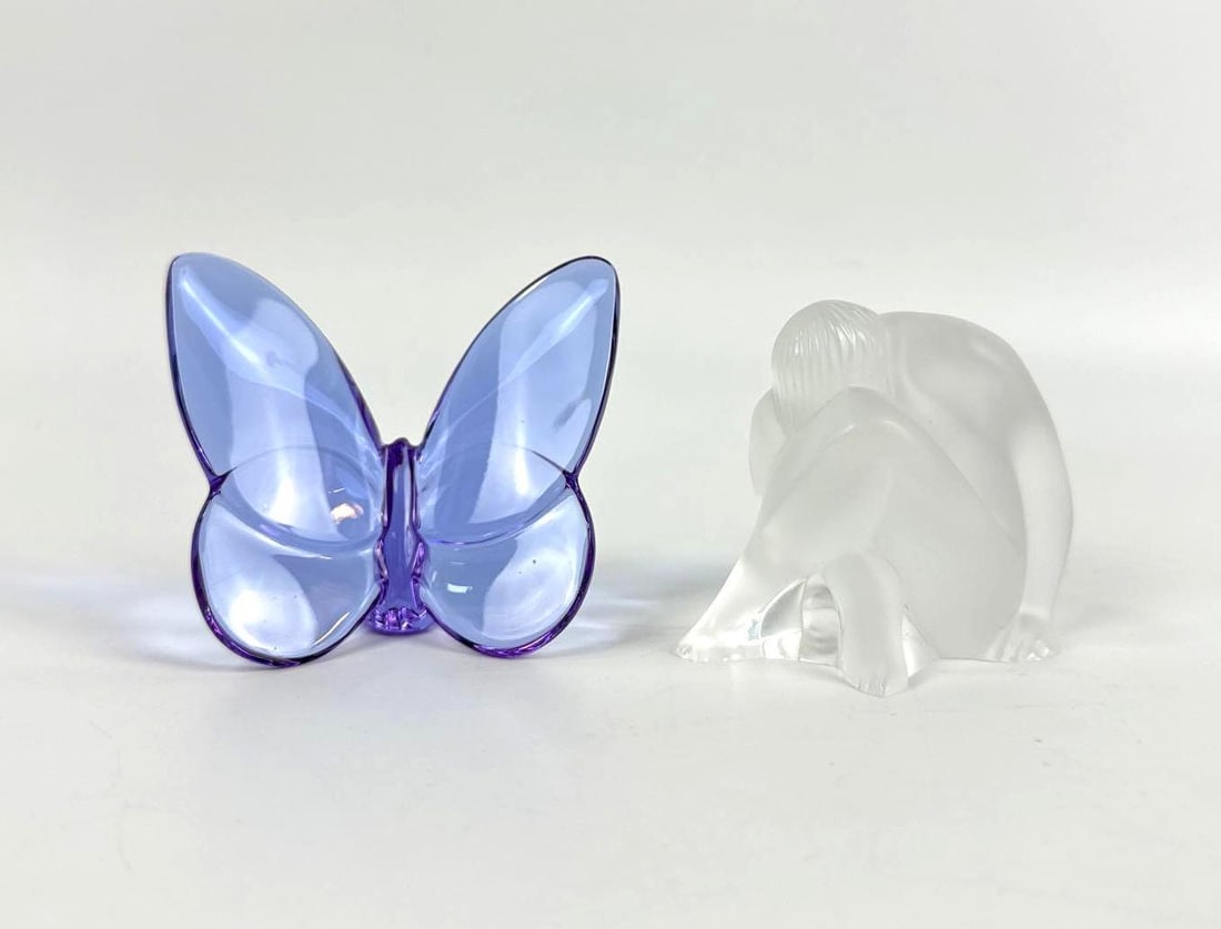 LALIQUE AND BACCARAT FRENCH CRYSTAL FIGURINE LOT: A pair of signed French art crystals including a violet butterfly and a frosted crystal kneeling nude figure. Approximate Dimensions: 2.5"H x 2.25"W Maker: Lalique & Baccarat Provenance